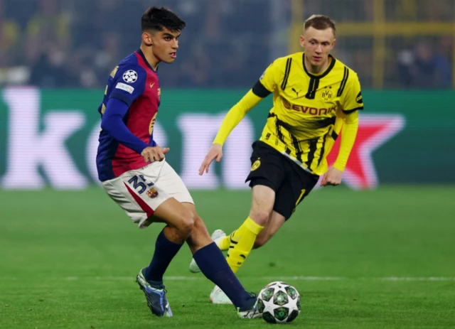 FC Barcelona's Gerard Martin in action with Borussia Dortmund's Maximilian Beier
