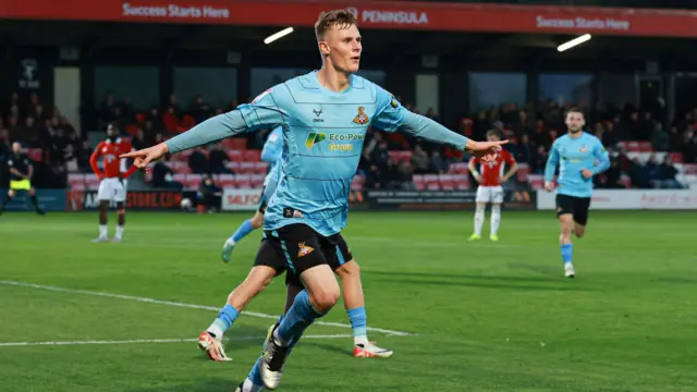 Rob Street of Doncaster Rovers scores to make it 0-1 and celebrates