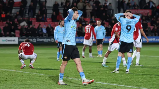Doncaster players with their heads in their hands