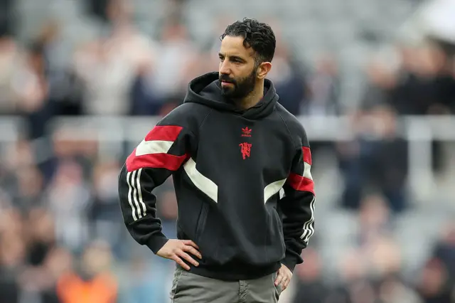 Ruben Amorim with his hands on his hips