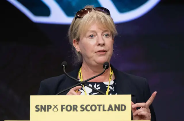 Shona Robison, speaking at a podium