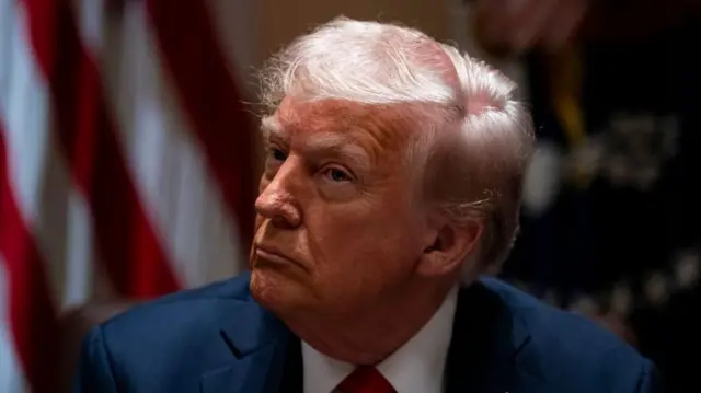 Headshot of Trump looking off to the side