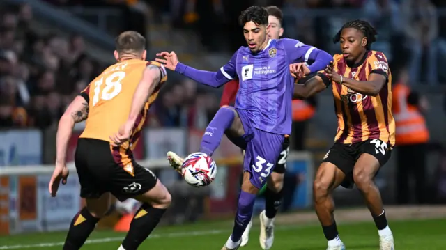 George Abbott of Notts County and Tayo Adaramola of Bradford City (right)