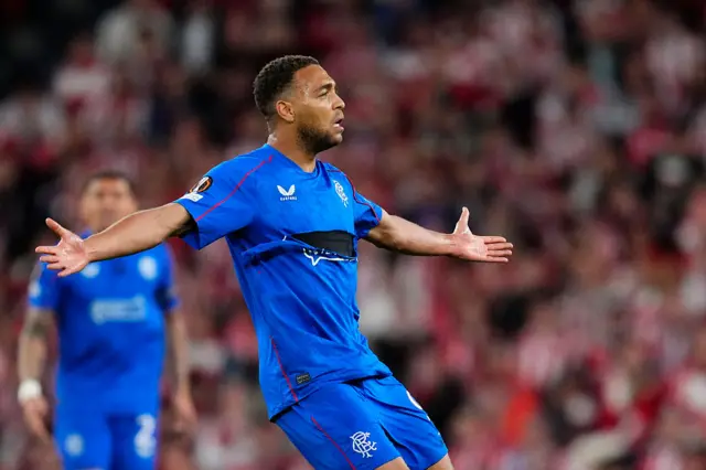 Cyriel Dessers centre-forward of Rangers FC and Nigeria protest to referee claims a penalty to the referee by showing him a broken helmet during the UEFA Europa League 2024/25 Quarter Final Second Leg match between Athletic Club and Rangers FC at Estadio de San Mames