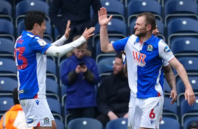 Blackburn Rovers' Sondre Tronstad (right) celebrates scoring their side's second goal of the game with team-mate Yuki Ohashi