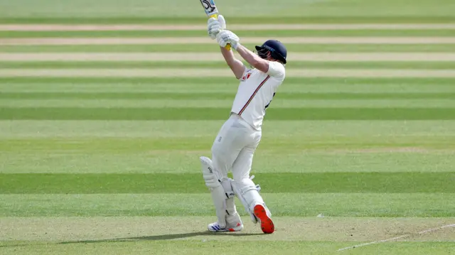 Jordan Cox hits a six