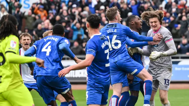 Carlisle players celebrate
