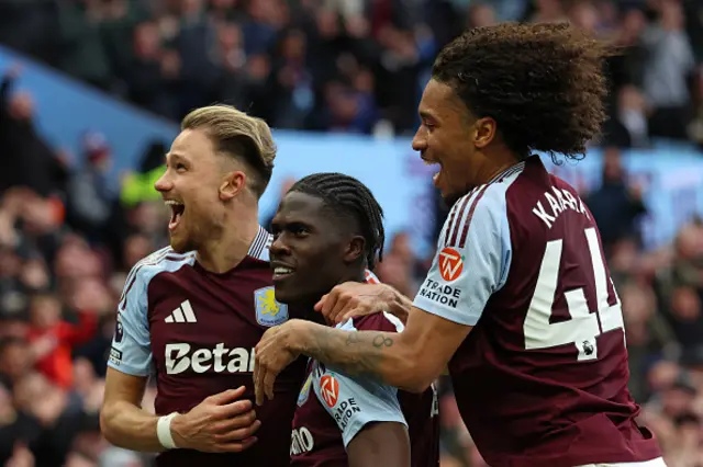Amadou Onana (C) celebrates