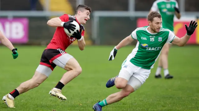 Down's Daniel Guinness cuts inside Fermanagh's Declan McCusker in the 2020 Ulster SFC game at Brewster Park