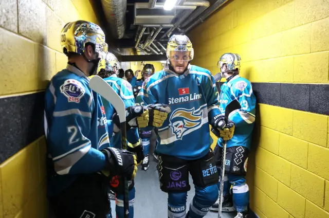 Mark Cooper leads the Giants on to the ice