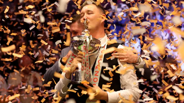 Kyren Wilson with the World Championship trophy