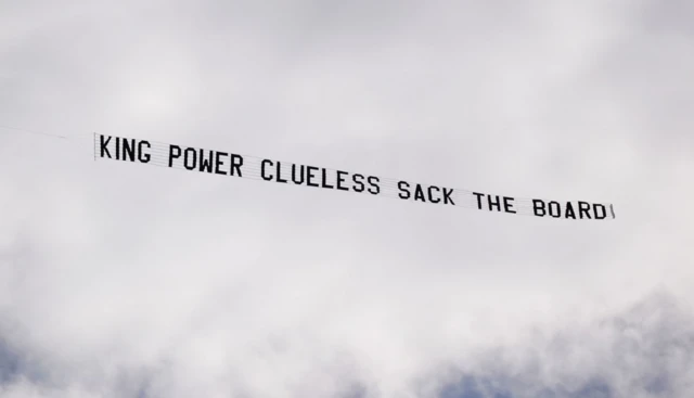 Aeroplane flies over the stadium with a banner before