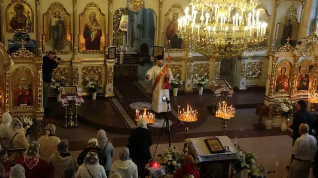 A priest leads the festive service at the Cathedral of the Nativity of Christ during Easter celebrations on April 20, 2025 in Odesa, Ukraine. Catholics and Orthodox Christians in Ukraine celebrate Easter on April 20.