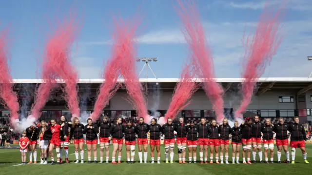 Wales players line-up in front of fireworks