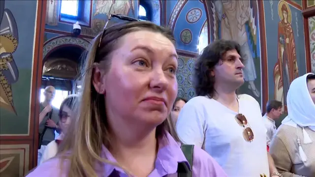 Olena wears a purple shirt during Easter morning service at church