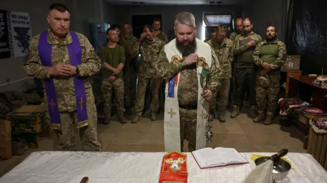 Military chaplains conducting Easter sunday service for front line soldiers