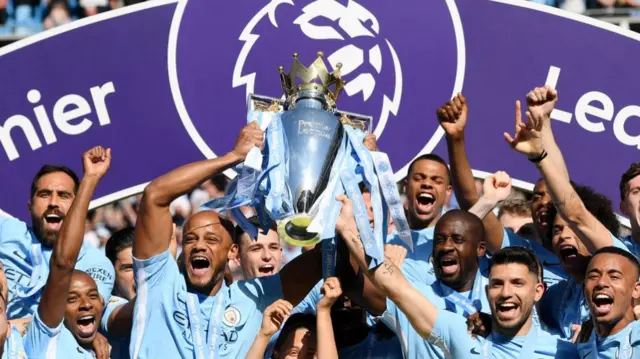Vincent Kompany of Manchester City lifts the Premier League Trophy