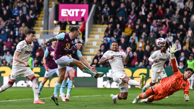 Josh Brownhill finishes past Michael Cooper to give Burnley the lead against Sheffield United