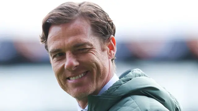 Burnley manager Scott Parker winks at the camera