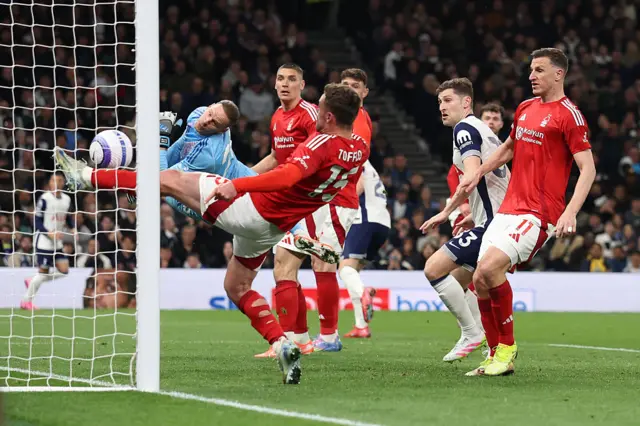 Toffolo hooks the ball off the line at the last second to prevent a Spurs goal