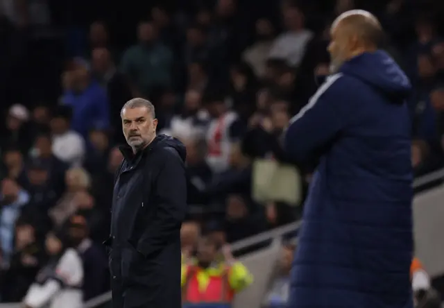 Ange looks along the touchline to opponent Nuno