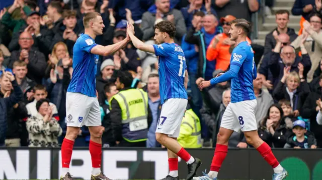Colby Bishop celebrates with Portsmouth team-mates