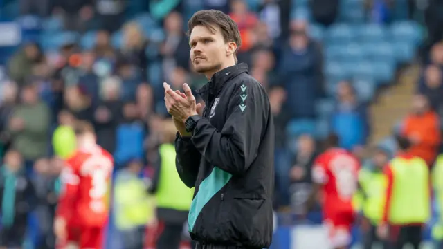 Sheffield Wednesday boss Danny Rohl claps fans at full-time