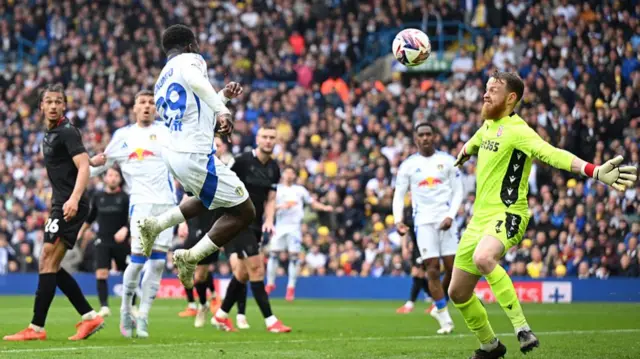 Willy Gnonto heads Leeds' sixth of the game against Stoke