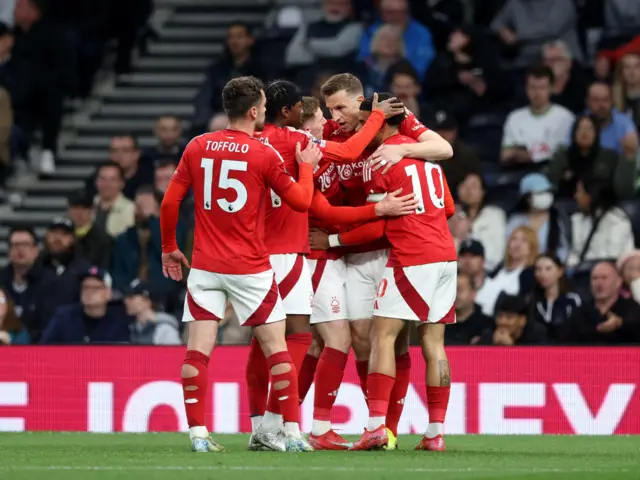 Wood is congratulated for his goal