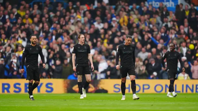 Stoke players trudge back to the halfway line after conceding a third against Leeds