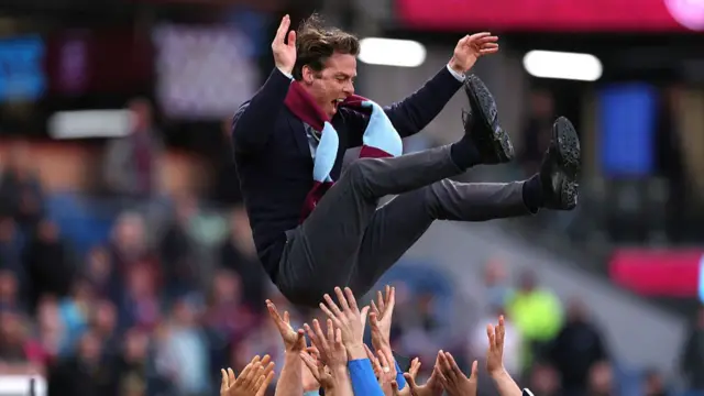 Scott Parker is thrown into the air by his Burnley players