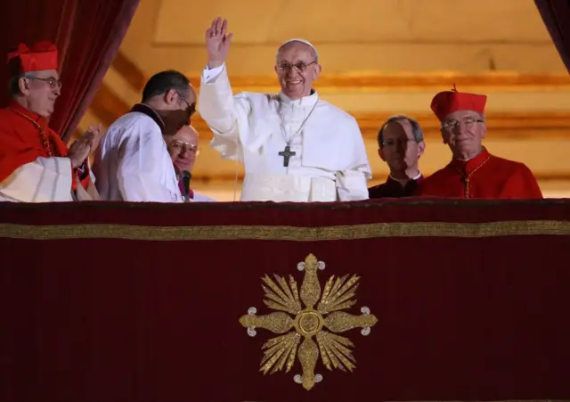 Pope Francis waves from a box