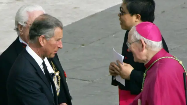 Charles shakes hands with James Harvey