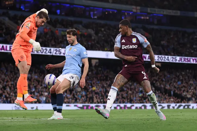 Stefan Ortega Moreno of Manchester City saves an effort by Marcus Rashford