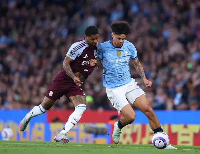 Marcus Rashford of Aston Villa in action with Nico O'Reilly