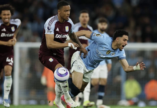 Aston Villa's Ezri Konsa in action with Manchester City's Omar Marmoush