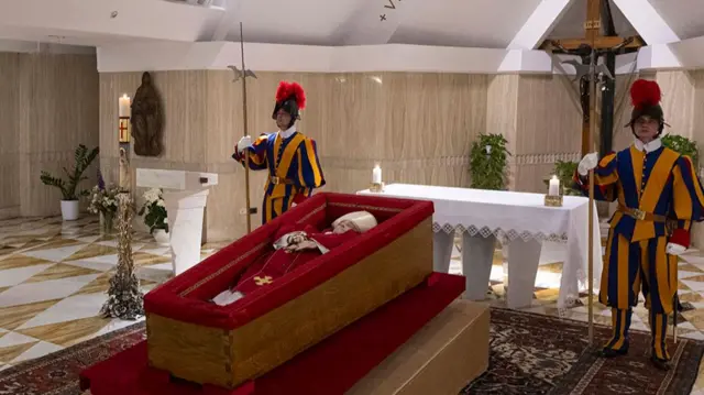 Members of the Swiss Guard stand over Pope Francis's body in the chapel