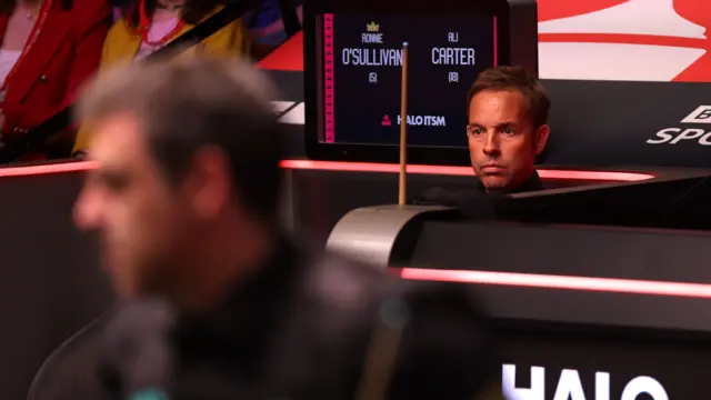 Ali Carter sits in his seat