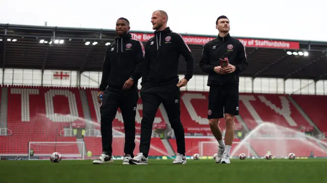 Sheffield United players on the pitch at Stoke City before the game