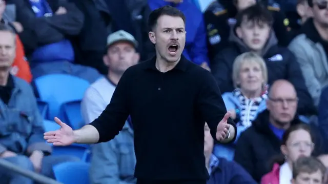 Aaron Ramsey on the touchline coaching Cardiff City