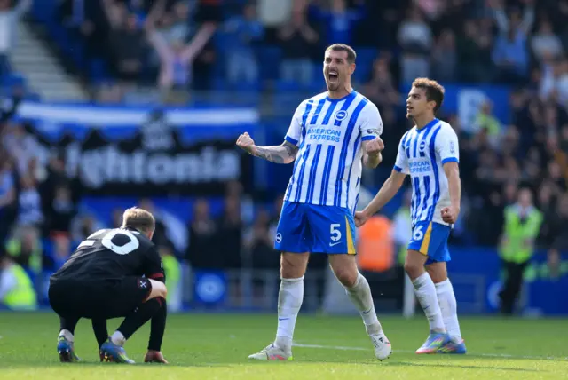 Brighton players celebrate at full time