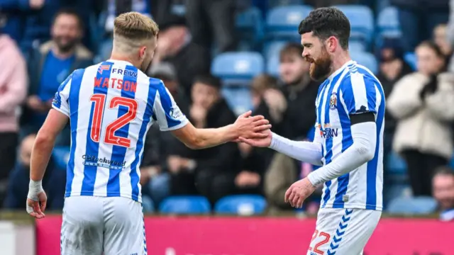 Watson and Donnelly celebrate the latter's goal