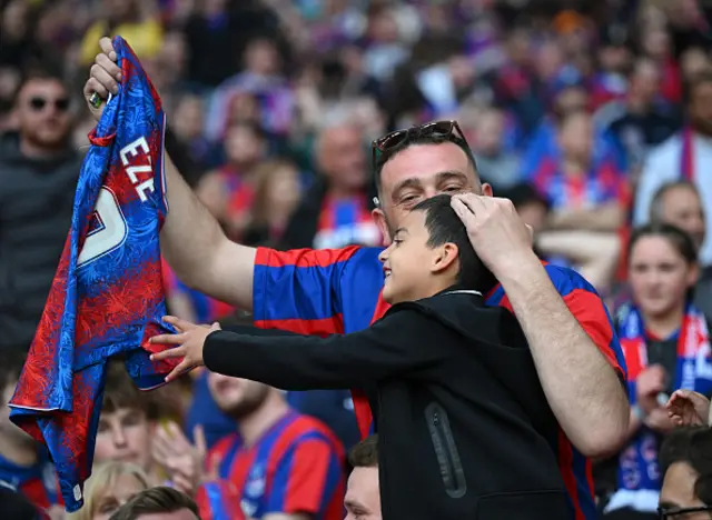 Fans of Crystal Palace celebrate victory