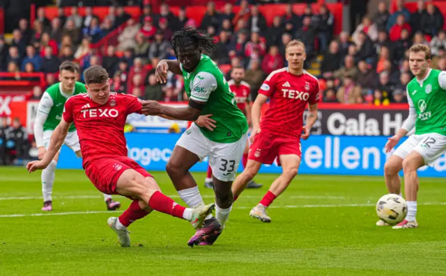 Kevin Nisbet gets a shot away against his former team