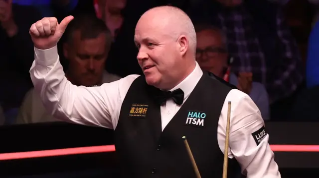 John Higgins gives the thumbs up to the Crucible after beating Xiao Guodong