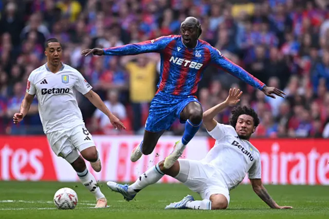 Jean-Philippe Mateta of Crystal Palace is challenged by Boubacar Kamara