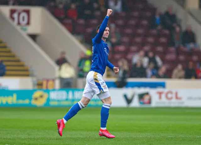 Makenzie Kirk salutes the travelling support at Fir Park