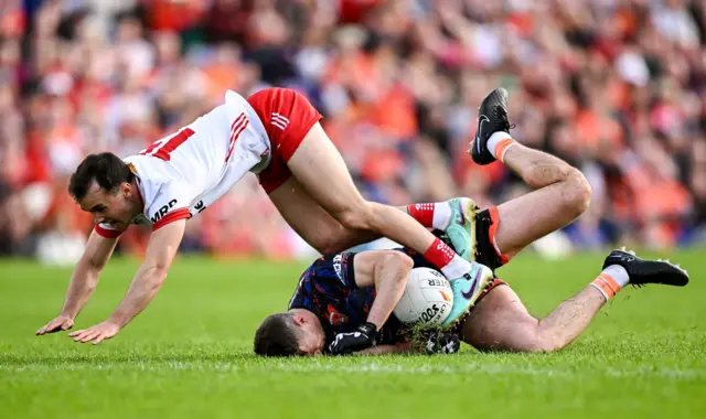 Darragh Canavan takes a tumble over Ethan Rafferty at Clones