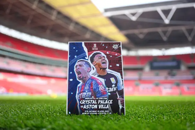 A detailed view of the match program on the pitch