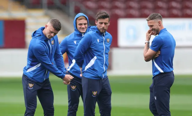 St Johnstone's Josh McPake (L) mimes a golf swing as Graham Carey (centre) and Barry Douglas watch on